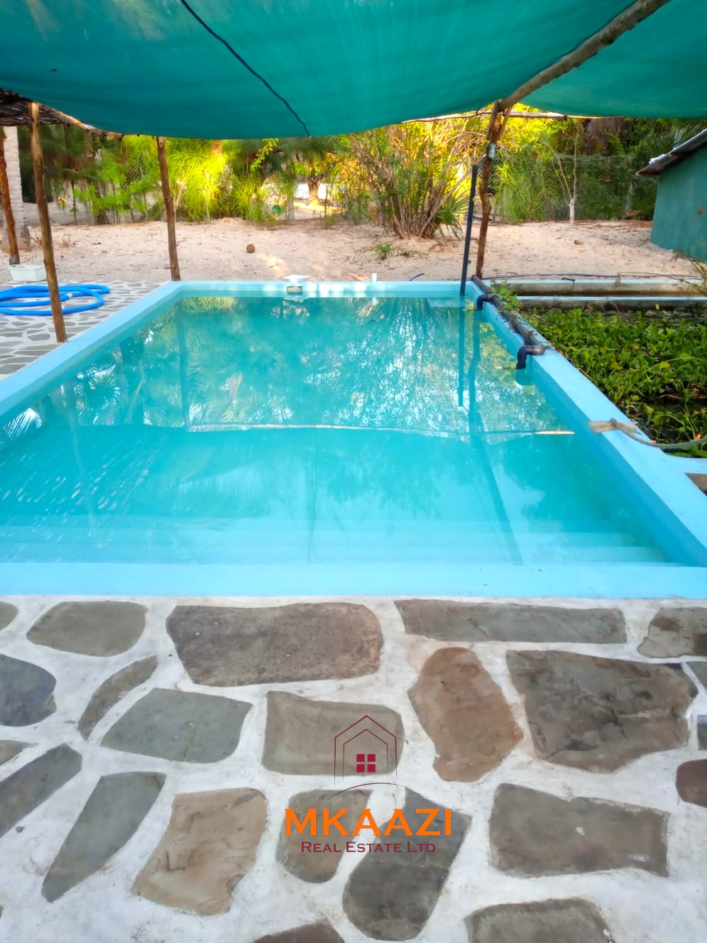 3-bedroom coastal home on 1-acre titled plot in Che Shale with solar panels, rainwater harvesting, balcony, and verandah. Expansion potential on adjoining 3/4-acre land.