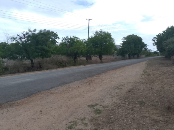 3 acres ocean-view land for sale along Bofa Road near Ngala Beach, featuring road frontage, subdivision potential, and a secure upscale neighborhood.