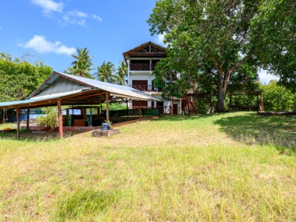 Luxury 2.7-acre creekfront property for sale in Mida Creek Watamu with ocean views, eco-lodge potential, and unique treehouse residence.