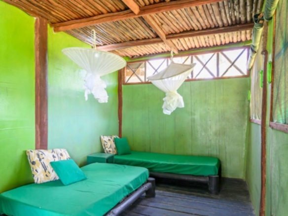 Luxury 2.7-acre creekfront property for sale in Mida Creek Watamu with ocean views, eco-lodge potential, and unique treehouse residence.