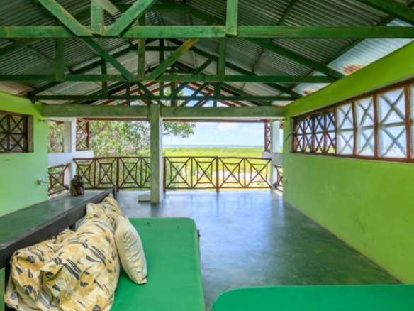 Luxury 2.7-acre creekfront property for sale in Mida Creek Watamu with ocean views, eco-lodge potential, and unique treehouse residence.