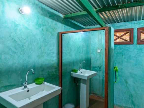 Luxury 2.7-acre creekfront property for sale in Mida Creek Watamu with ocean views, eco-lodge potential, and unique treehouse residence.