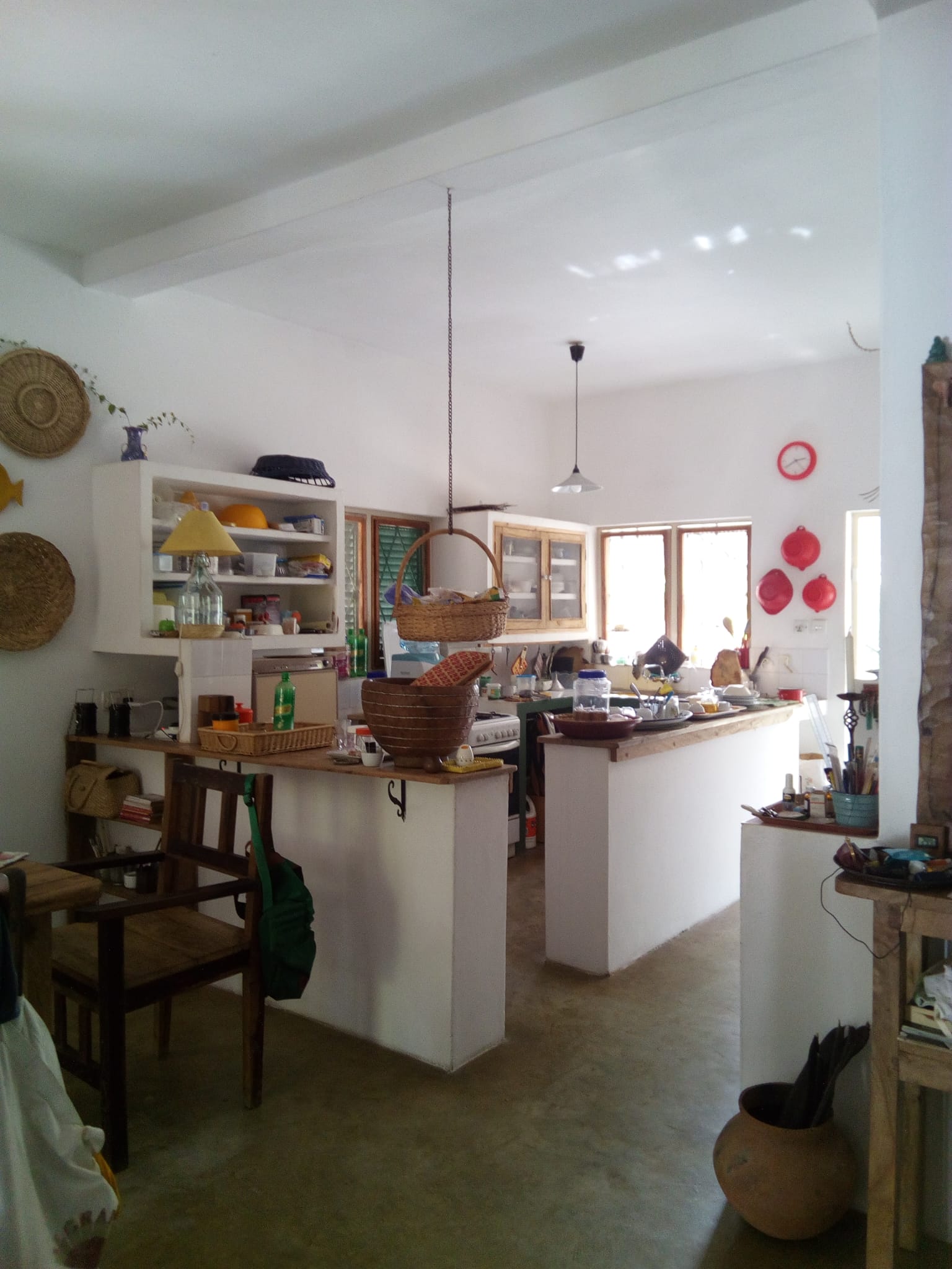 3-bedroom coastal home on 1-acre titled plot in Che Shale with solar panels, rainwater harvesting, balcony, and verandah. Expansion potential on adjoining 3/4-acre land.