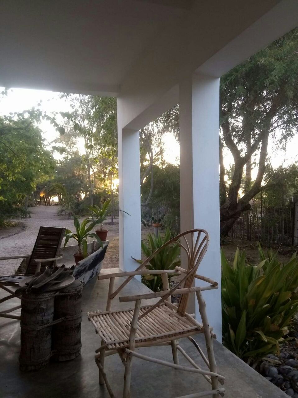 3-bedroom coastal home on 1-acre titled plot in Che Shale with solar panels, rainwater harvesting, balcony, and verandah. Expansion potential on adjoining 3/4-acre land.