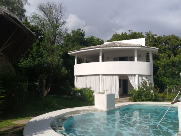 2-bedroom duplex apartment for sale at Iguana Beach Malindi with double kitchen, swimming pool, verandah, and secure low-density compound near Lamu Road.