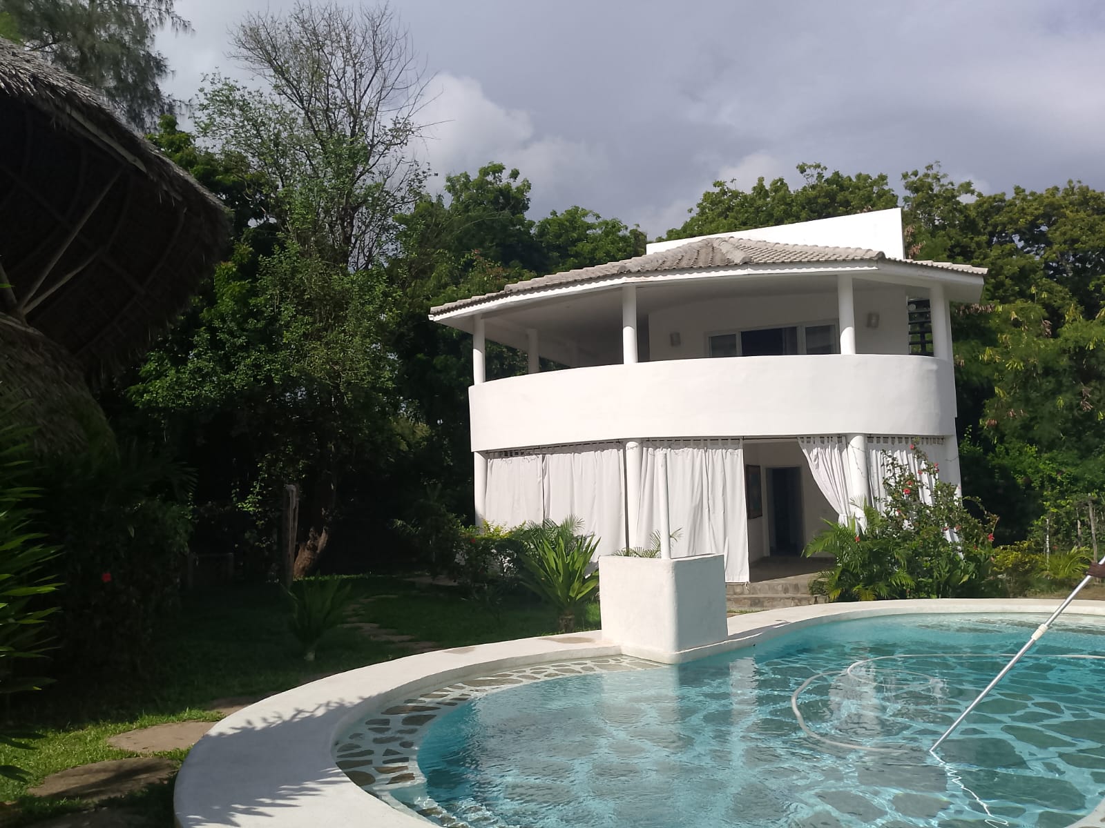 2-bedroom duplex apartment for sale at Iguana Beach Malindi with double kitchen, swimming pool, verandah, and secure low-density compound near Lamu Road.