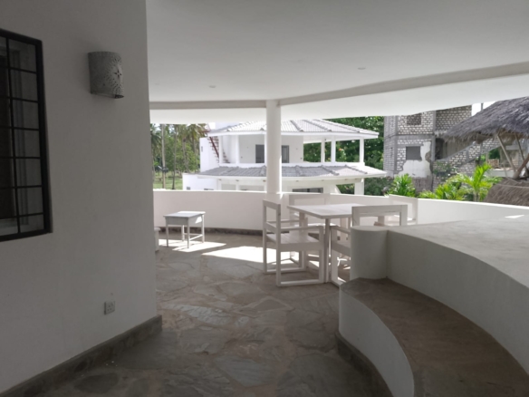 2-bedroom duplex apartment for sale at Iguana Beach Malindi with double kitchen, swimming pool, verandah, and secure low-density compound near Lamu Road.