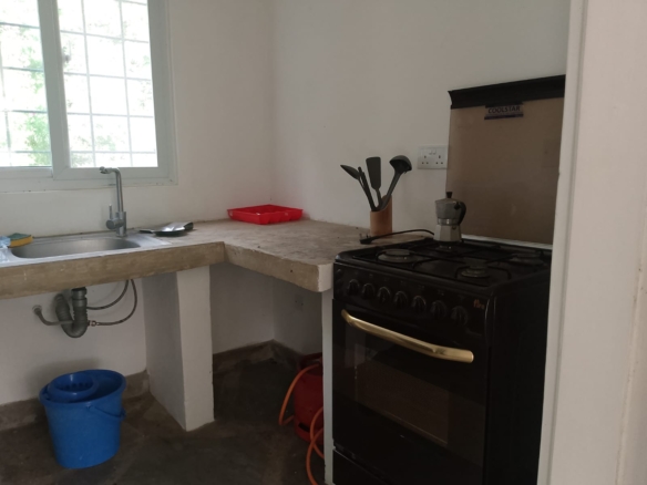 2-bedroom duplex apartment for sale at Iguana Beach Malindi with double kitchen, swimming pool, verandah, and secure low-density compound near Lamu Road.