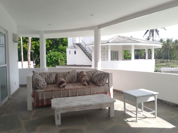 2-bedroom duplex apartment for sale at Iguana Beach Malindi with double kitchen, swimming pool, verandah, and secure low-density compound near Lamu Road.