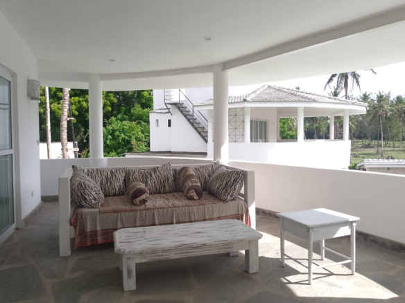 2-bedroom duplex apartment for sale at Iguana Beach Malindi with double kitchen, swimming pool, verandah, and secure low-density compound near Lamu Road.