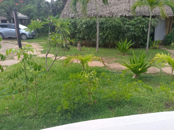 Luxury 2-bedroom duplex apartment at Iguana Beach Malindi with rooftop pool, double kitchen, verandah, and secure low-density compound near Lamu Road.