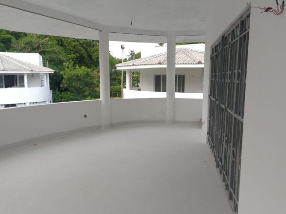 Luxury 2-bedroom duplex apartment at Iguana Beach Malindi with rooftop pool, double kitchen, verandah, and secure low-density compound near Lamu Road.
