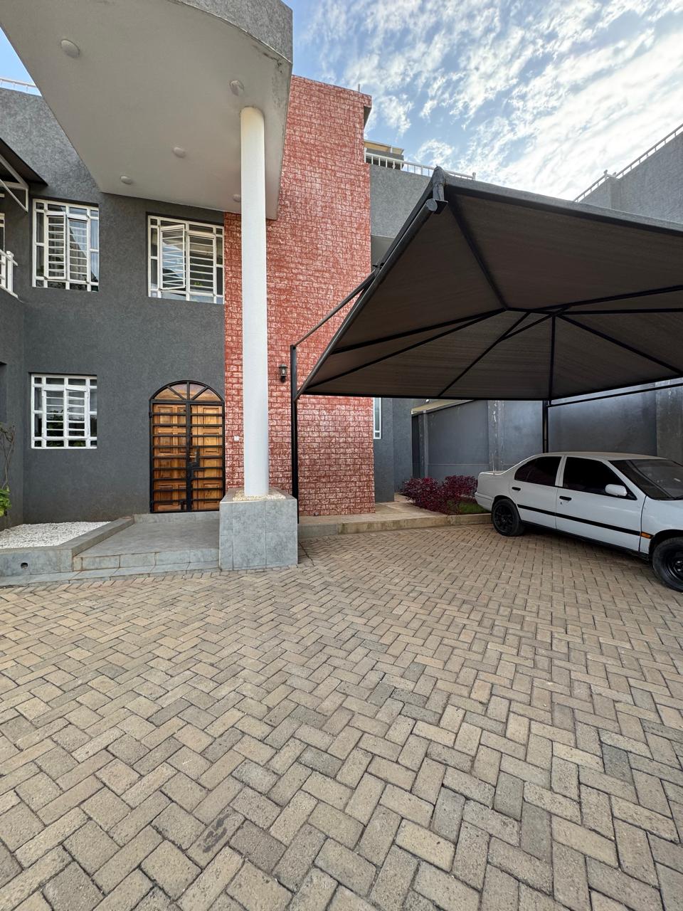 Luxury 4-bedroom house with DSQ for sale in gated community featuring solar panels, modern finishes, and premium amenities.