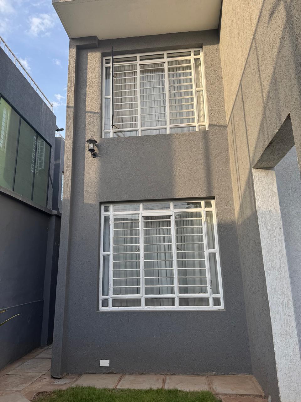 Luxury 4-bedroom house with DSQ for sale in gated community featuring solar panels, modern finishes, and premium amenities.