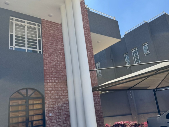 Luxury 4-bedroom house with DSQ for sale in gated community featuring solar panels, modern finishes, and premium amenities.