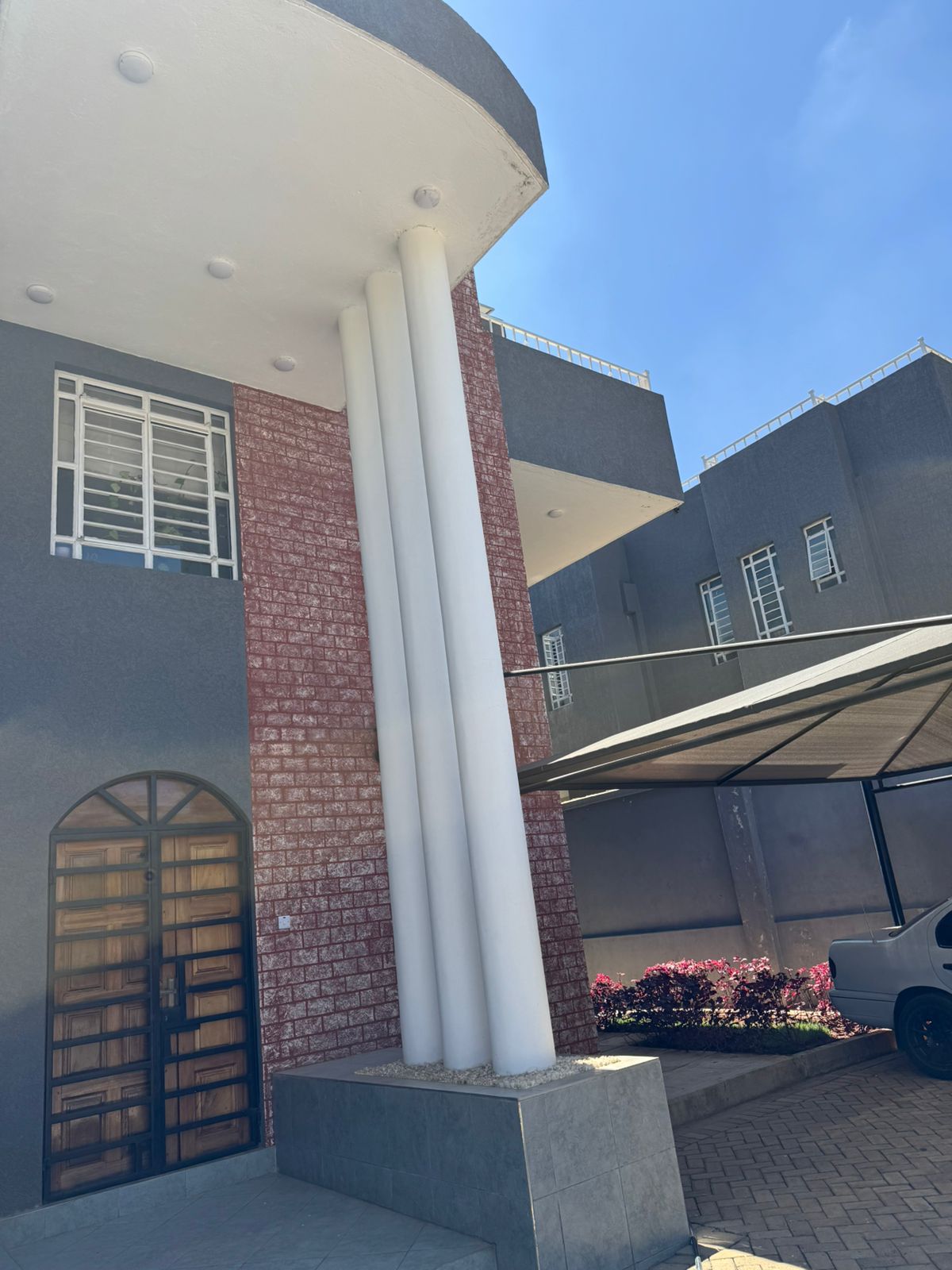 Luxury 4-bedroom house with DSQ for sale in gated community featuring solar panels, modern finishes, and premium amenities.
