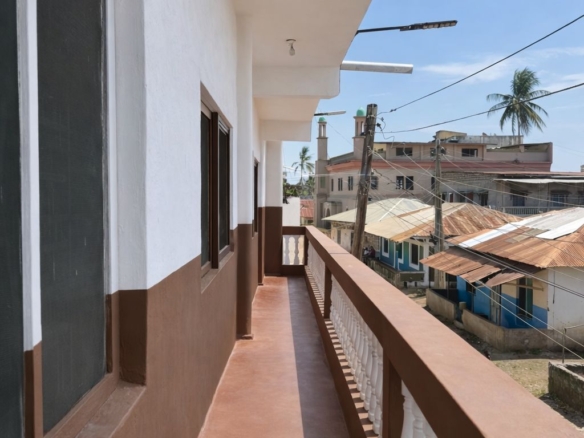 Apartment block for sale in Majengo Malindi with 10 units generating KES 110,000 monthly income, expandable structure and road frontage.