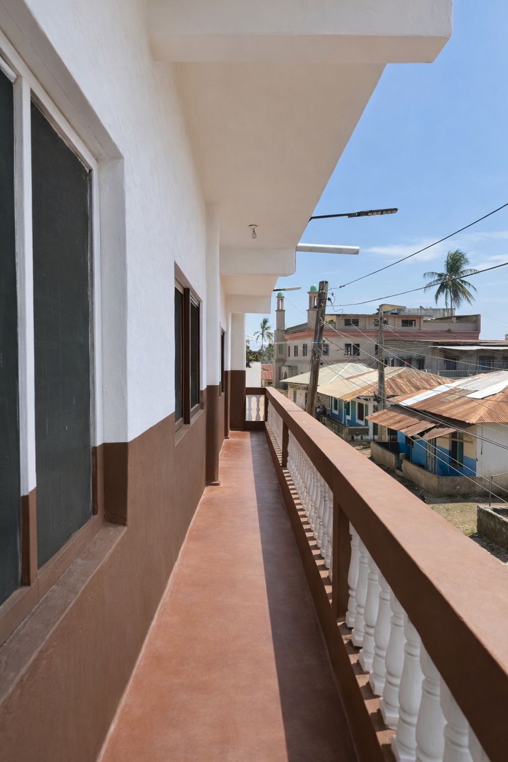 Apartment block for sale in Majengo Malindi with 10 units generating KES 110,000 monthly income, expandable structure and road frontage.