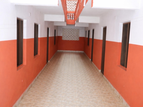 Apartment block for sale in Majengo Malindi with 10 units generating KES 110,000 monthly income, expandable structure and road frontage.