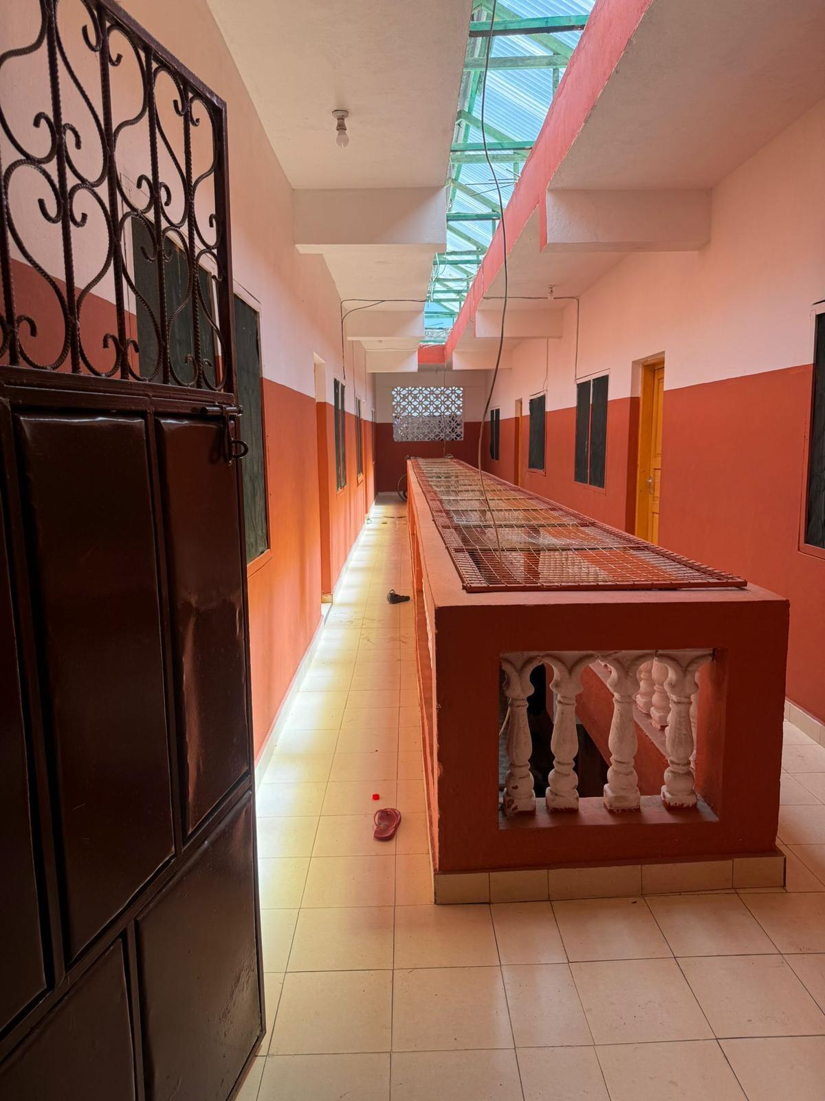 Apartment block for sale in Majengo Malindi with 10 units generating KES 110,000 monthly income, expandable structure and road frontage.