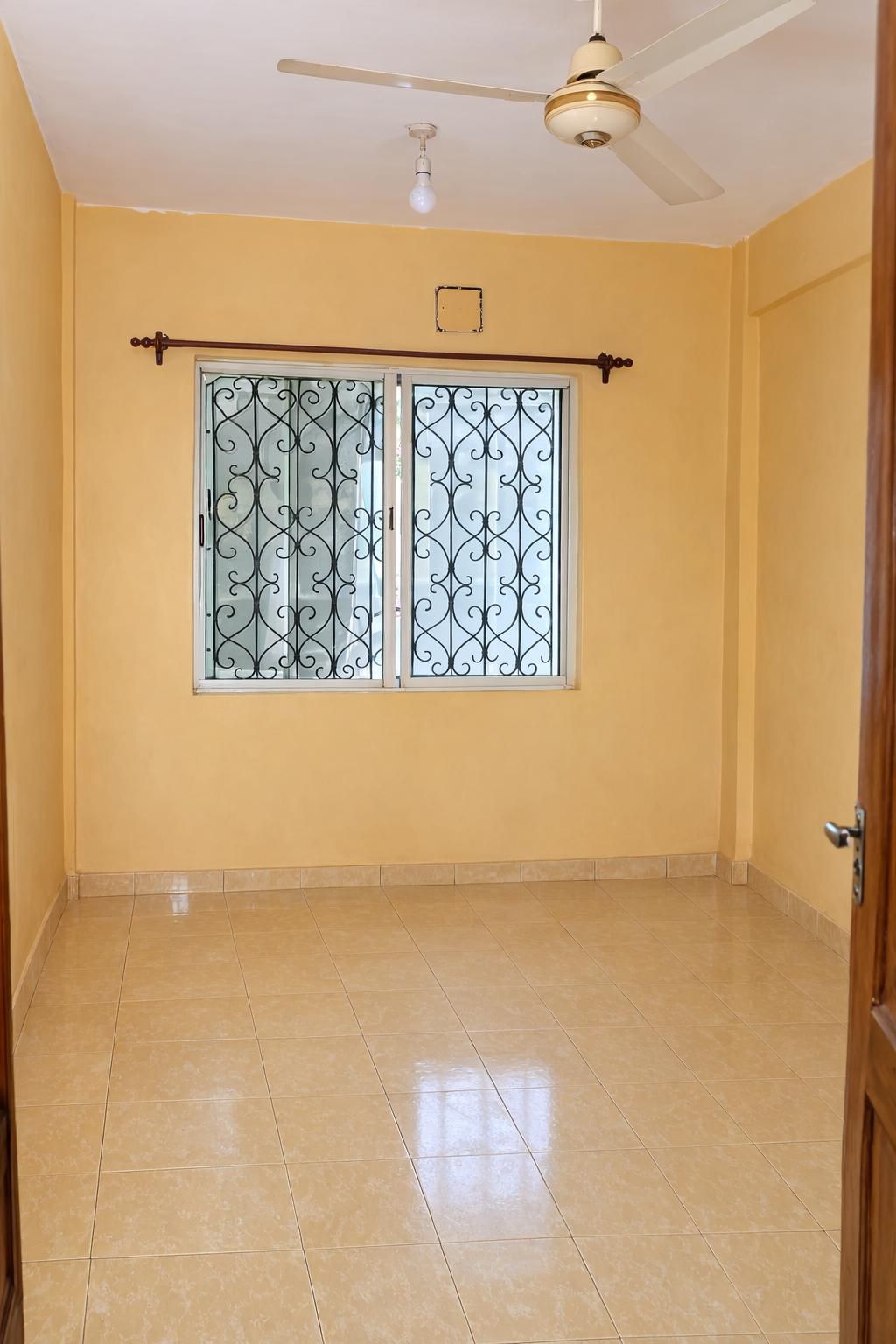 Apartment block for sale in Majengo Malindi with 10 units generating KES 110,000 monthly income, expandable structure and road frontage.