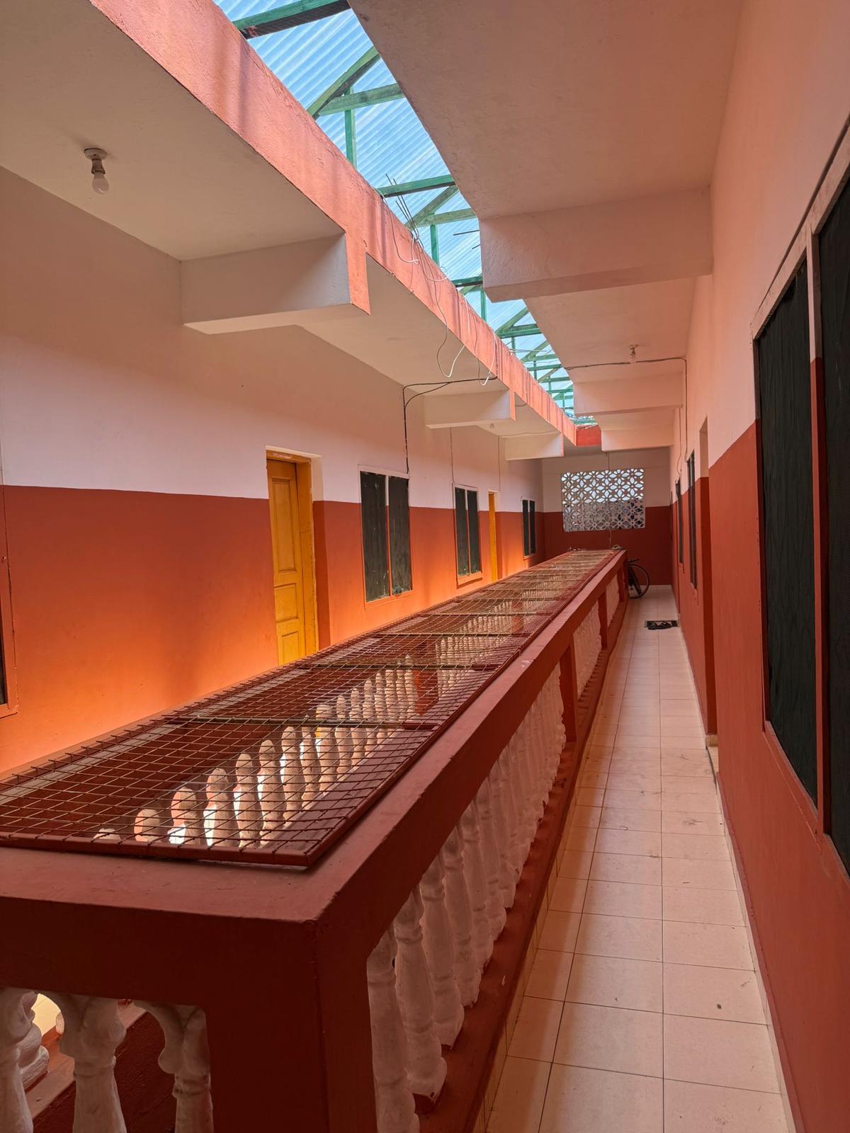 Apartment block for sale in Majengo Malindi with 10 units generating KES 110,000 monthly income, expandable structure and road frontage.