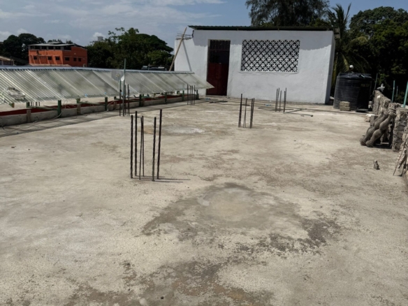 Apartment block for sale in Majengo Malindi with 10 units generating KES 110,000 monthly income, expandable structure and road frontage.