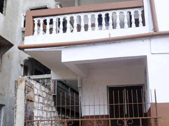 Apartment block for sale in Majengo Malindi with 10 units generating KES 110,000 monthly income, expandable structure and road frontage.