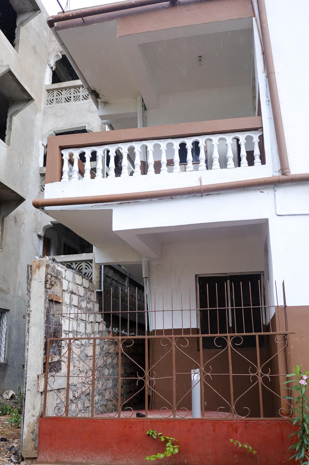 Apartment block for sale in Majengo Malindi with 10 units generating KES 110,000 monthly income, expandable structure and road frontage.