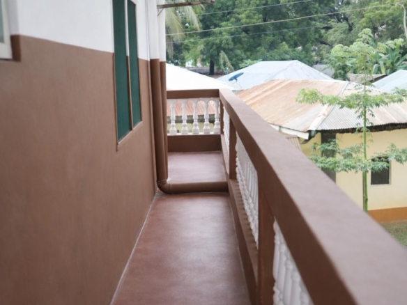 Apartment block for sale in Majengo Malindi with 10 units generating KES 110,000 monthly income, expandable structure and road frontage.