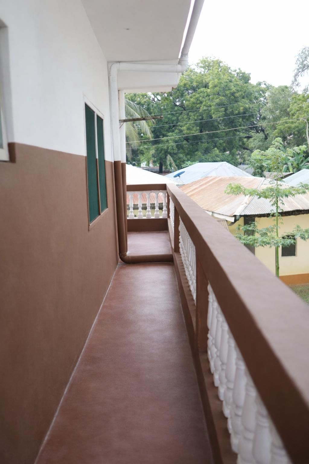 Apartment block for sale in Majengo Malindi with 10 units generating KES 110,000 monthly income, expandable structure and road frontage.