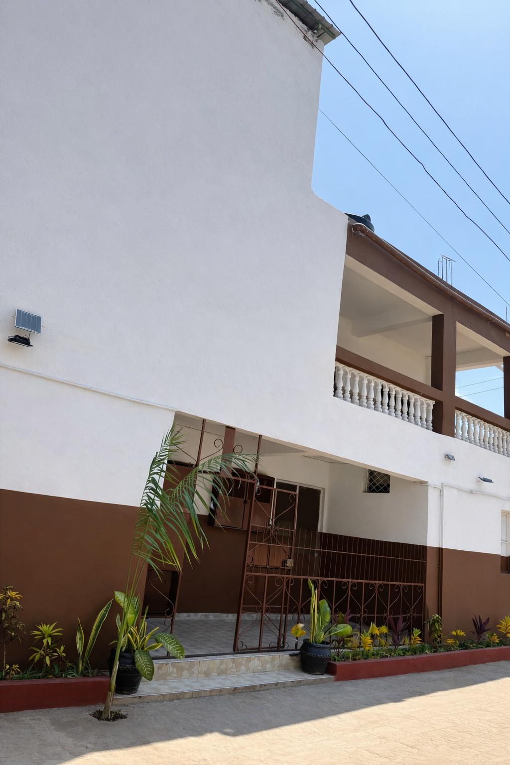 Apartment block for sale in Majengo Malindi with 10 units generating KES 110,000 monthly income, expandable structure and road frontage.