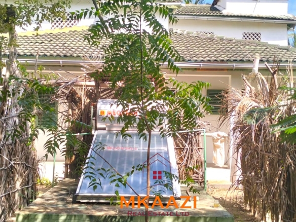 3-bedroom coastal home on 1-acre titled plot in Che Shale with solar panels, rainwater harvesting, balcony, and verandah. Expansion potential on adjoining 3/4-acre land.