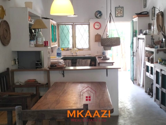3-bedroom coastal home on 1-acre titled plot in Che Shale with solar panels, rainwater harvesting, balcony, and verandah. Expansion potential on adjoining 3/4-acre land.