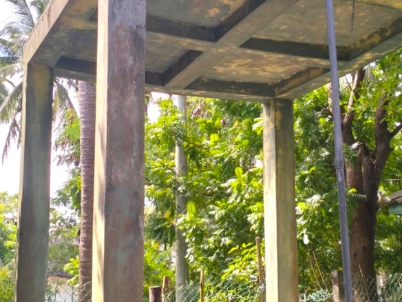 3-bedroom coastal home on 1-acre titled plot in Che Shale with solar panels, rainwater harvesting, balcony, and verandah. Expansion potential on adjoining 3/4-acre land.