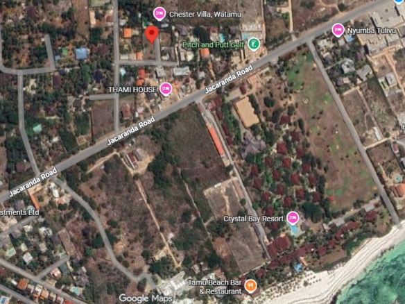 Prime 1-acre land for sale in Watamu near Pitch and Putt Golf, walled on three sides with easy access to Jacaranda Road and amenities.