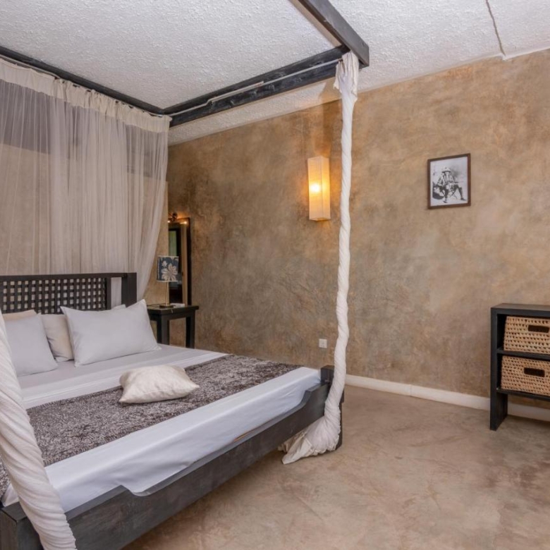 Luxury 1-bedroom beachfront apartment at The Lawford Kenya with ocean views, swimming pools, restaurant, and entertainment facilities available for long-term rent.