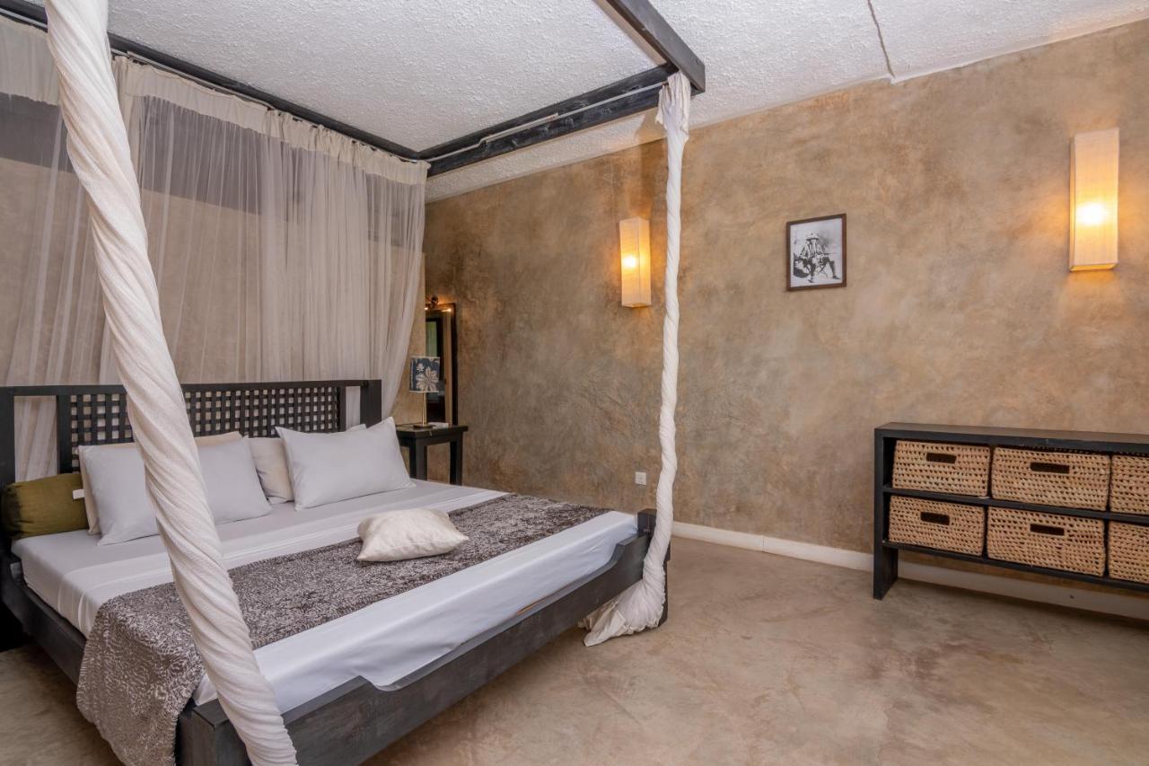 Luxury 1-bedroom beachfront apartment at The Lawford Kenya with ocean views, swimming pools, restaurant, and entertainment facilities available for long-term rent.
