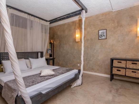 2-bedroom beachfront apartment for rent at Lawfords Malindi with swimming pools, gardens, entertainment facilities, and ocean views.