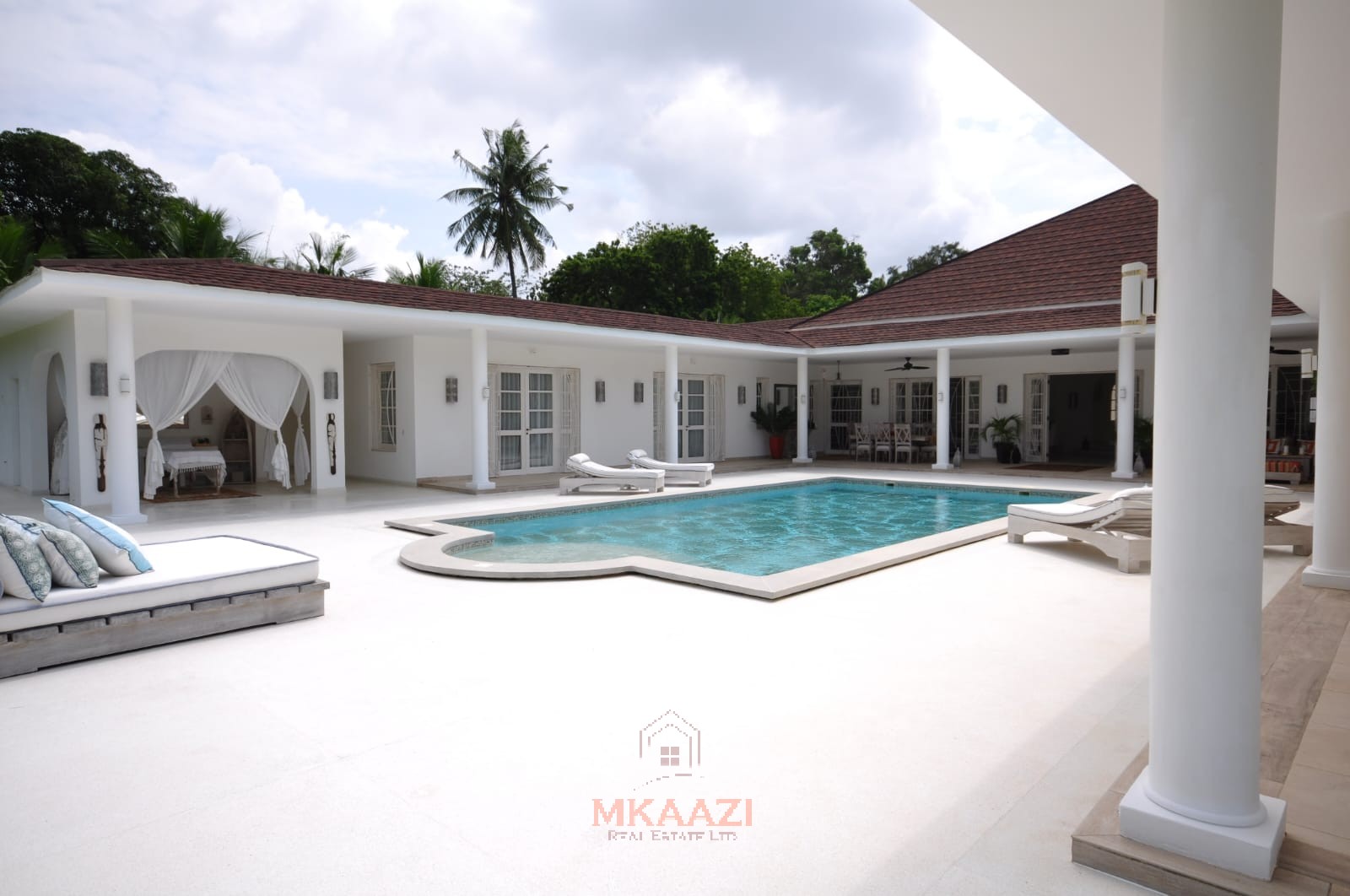 Luxury 4-bedroom villa for sale in Malindi near Casuarina Road with pool, landscaped gardens, staff quarters, and high-end finishes on 1.25 acres.