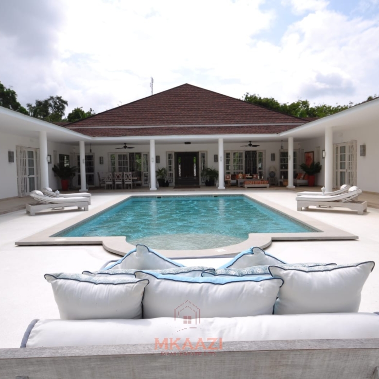 Luxury 4-bedroom villa for sale in Malindi near Casuarina Road with pool, landscaped gardens, staff quarters, and high-end finishes on 1.25 acres.