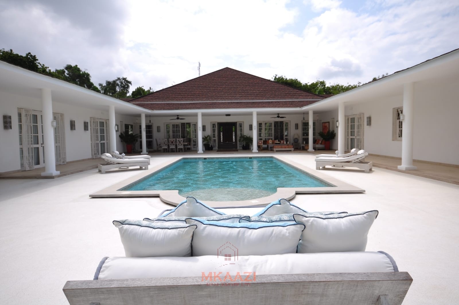 Luxury 4-bedroom villa for sale in Malindi near Casuarina Road with pool, landscaped gardens, staff quarters, and high-end finishes on 1.25 acres.