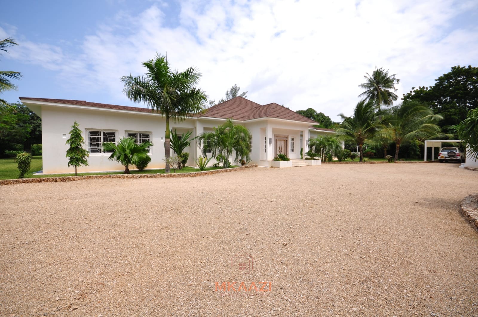 Luxury 4-bedroom villa for sale in Malindi near Casuarina Road with pool, landscaped gardens, staff quarters, and high-end finishes on 1.25 acres.
