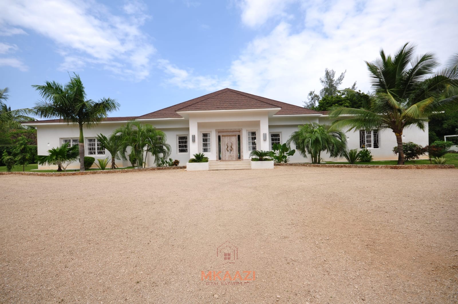 Luxury 4-bedroom villa for sale in Malindi near Casuarina Road with pool, landscaped gardens, staff quarters, and high-end finishes on 1.25 acres.