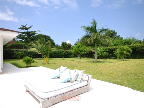 Luxury 4-bedroom villa for sale in Malindi near Casuarina Road with pool, landscaped gardens, staff quarters, and high-end finishes on 1.25 acres.