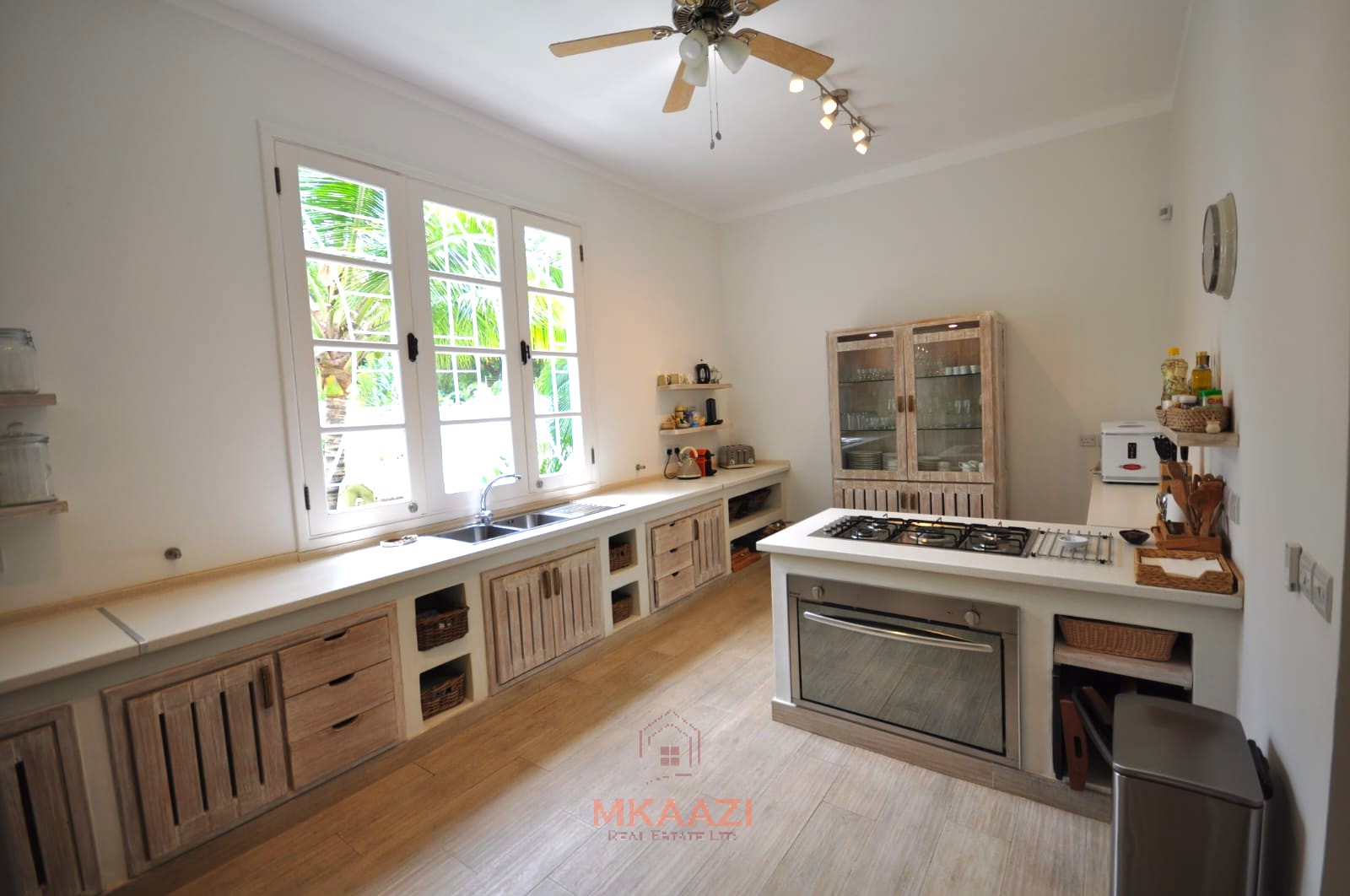 Luxury 4-bedroom villa for sale in Malindi near Casuarina Road with pool, landscaped gardens, staff quarters, and high-end finishes on 1.25 acres.