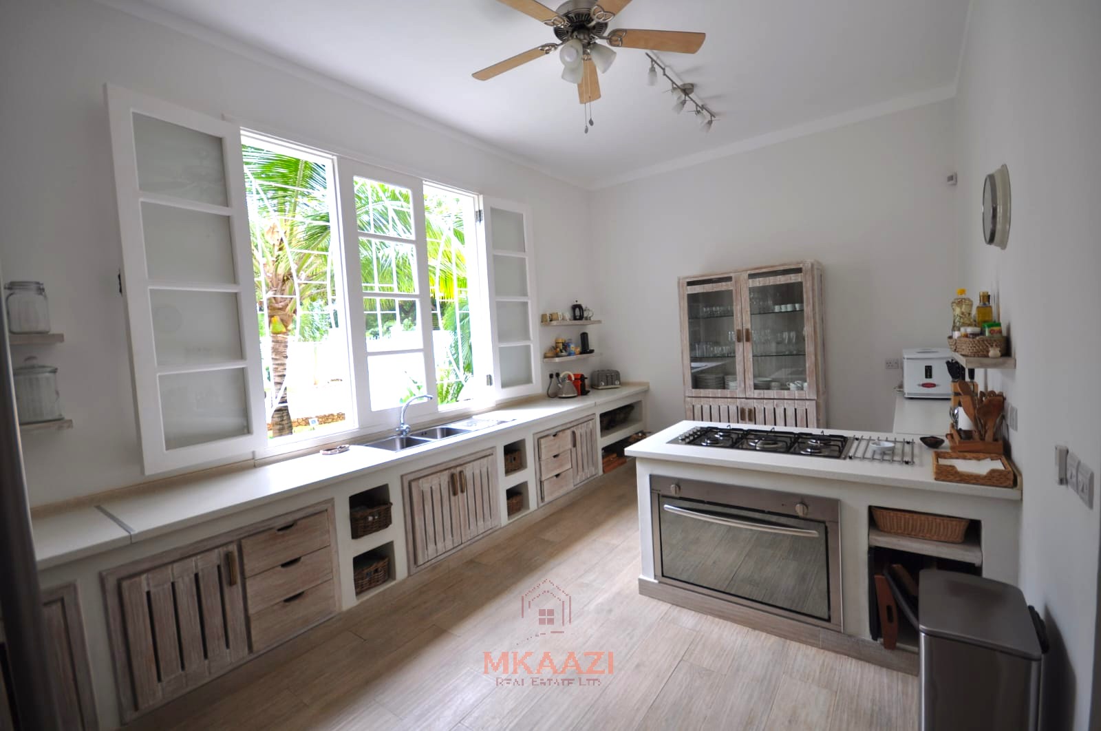 Luxury 4-bedroom villa for sale in Malindi near Casuarina Road with pool, landscaped gardens, staff quarters, and high-end finishes on 1.25 acres.