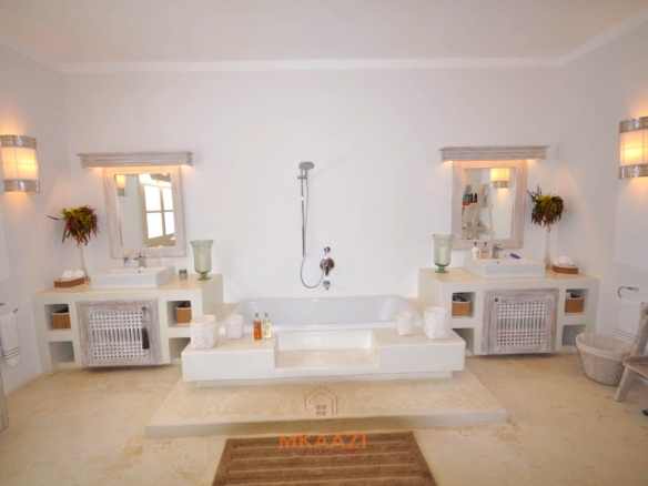 Luxury 4-bedroom villa for sale in Malindi near Casuarina Road with pool, landscaped gardens, staff quarters, and high-end finishes on 1.25 acres.