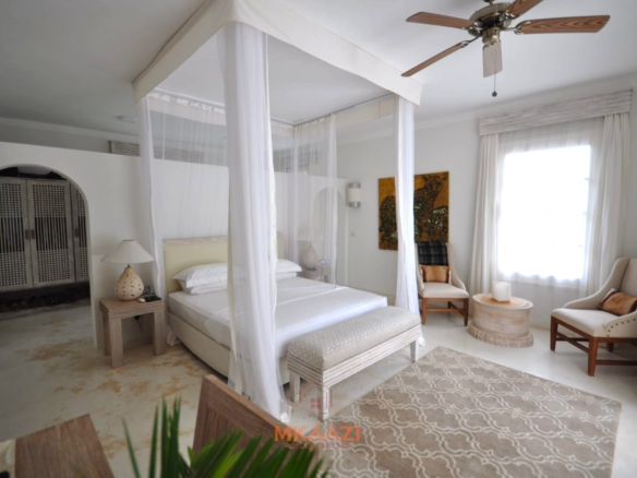 Luxury 4-bedroom villa for sale in Malindi near Casuarina Road with pool, landscaped gardens, staff quarters, and high-end finishes on 1.25 acres.