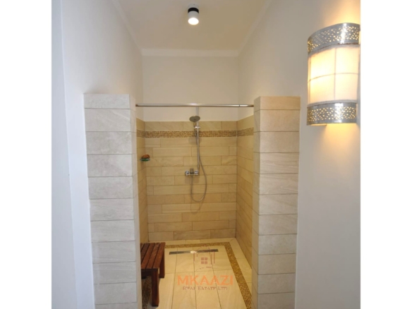 Luxury 4-bedroom villa for sale in Malindi near Casuarina Road with pool, landscaped gardens, staff quarters, and high-end finishes on 1.25 acres.